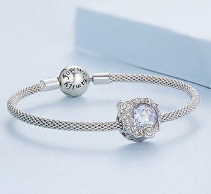 Charm fijo destellos entrelazados y rosas