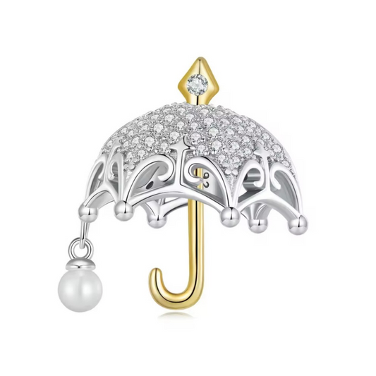 Hermoso charm de sombrilla con circonias dos tonos