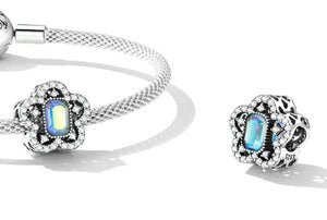 Charm fijo flor pavé con cristal tornasol
