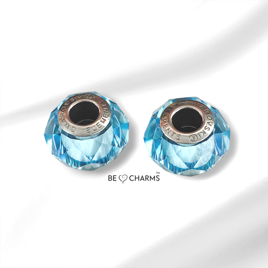 Par de charms swarovski zafiro facetado redondo