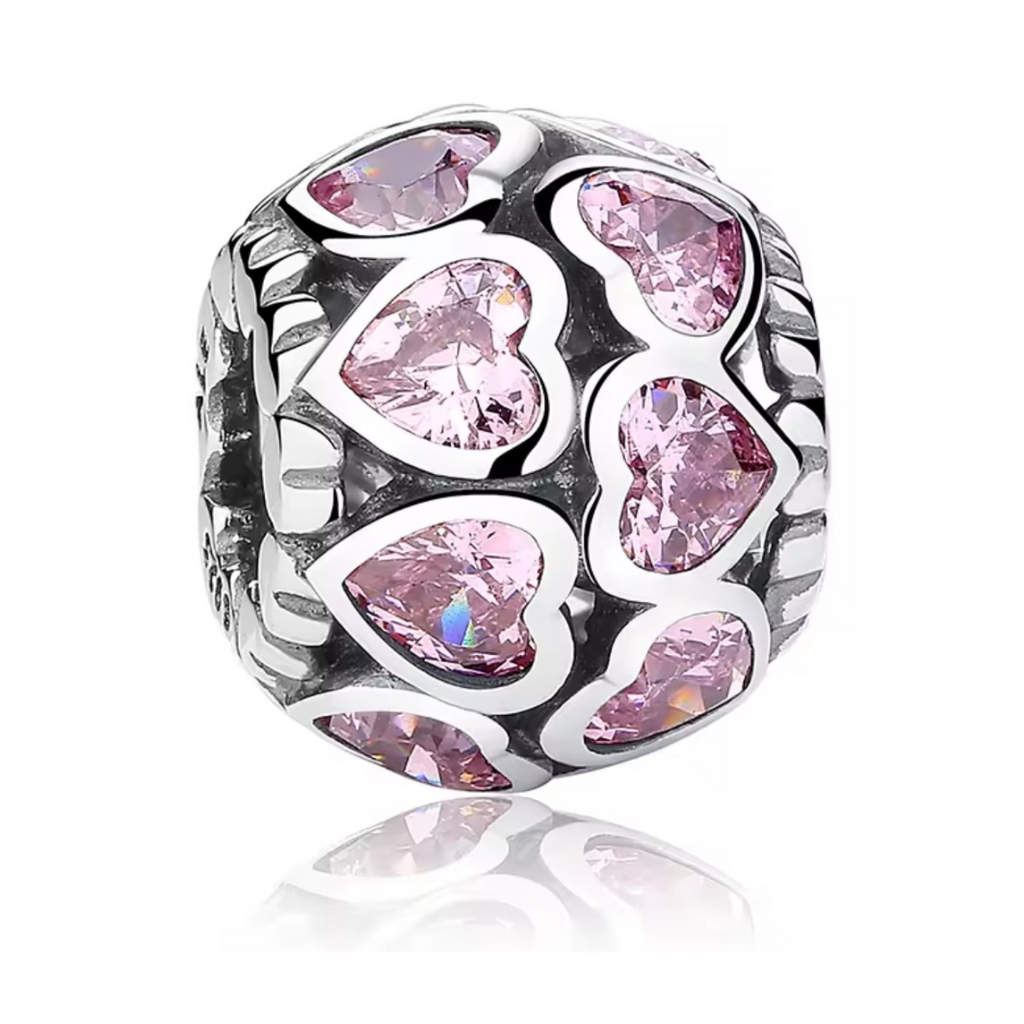 Charm corazones pavé rosados