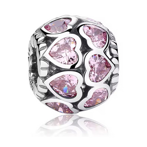 Charm corazones pavé rosados
