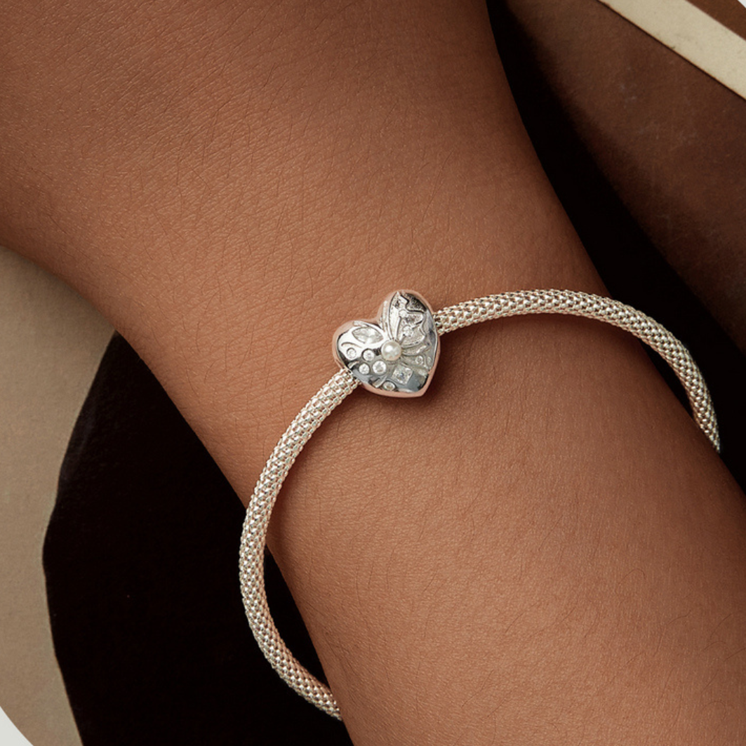 Charm majestuoso corazon con perla