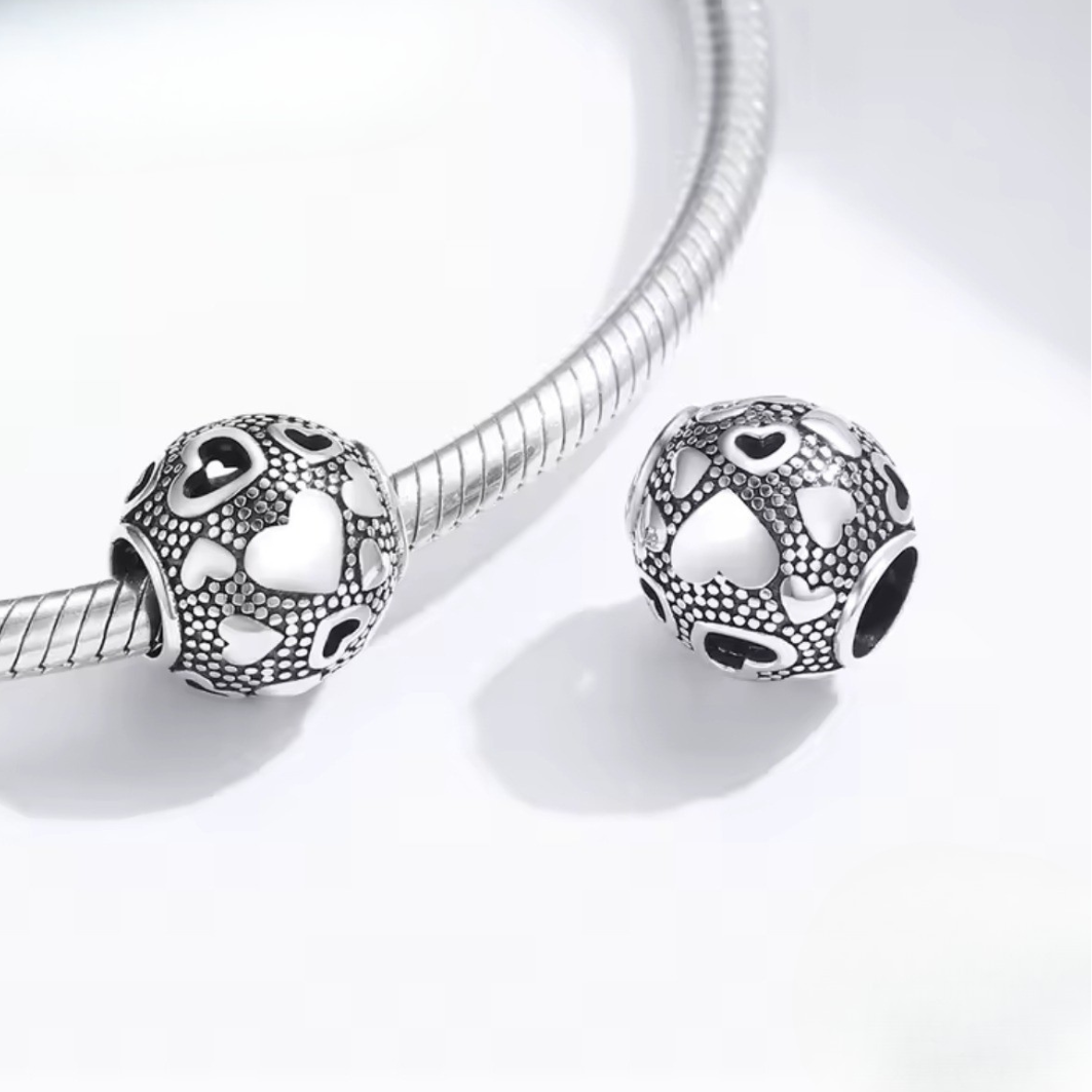 Charm juego de corazones